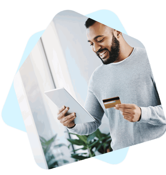 Man holding ipad and credit card